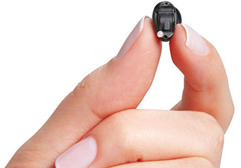 hand-holding-tiny-hearing-aid-invesibel-2